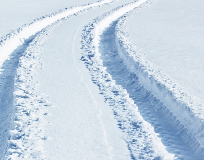 Car tire tracks in snow